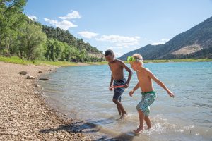 Two boys run to shore at Harvey Gap State Park north of Sil