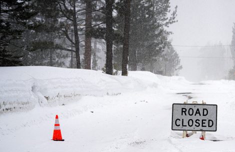Road closed in the mountains during a winter storm.