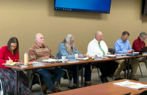 Garfield County Board of County Commissioners and administration discuss a resolution in a regular meeting in Rifle, Colorado.