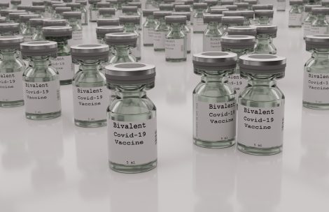 Collection of COVID-19 bivalent vaccine vials.