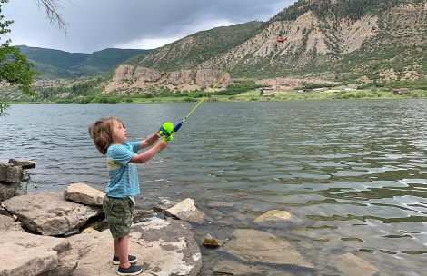 A young boy casts a fishing pole at Sweetwater Lake in northeast Garfield County.