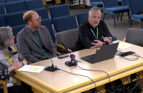 Director of Social Services Jackie Skramstad, Dr. David Conklin, and Hans Lutgring, regional outreach director, all of Mind Springs Health, address the Board of County Commissioners in a meeting.