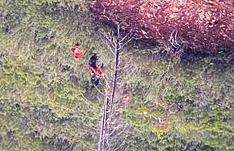 Members of Garfield County Search and Rescue assist a stranded climber down from the mountainside in Glenwood Springs, CO. This image was captured with a drone.