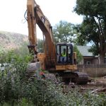Crews demolish two older county-owned houses for parking lot