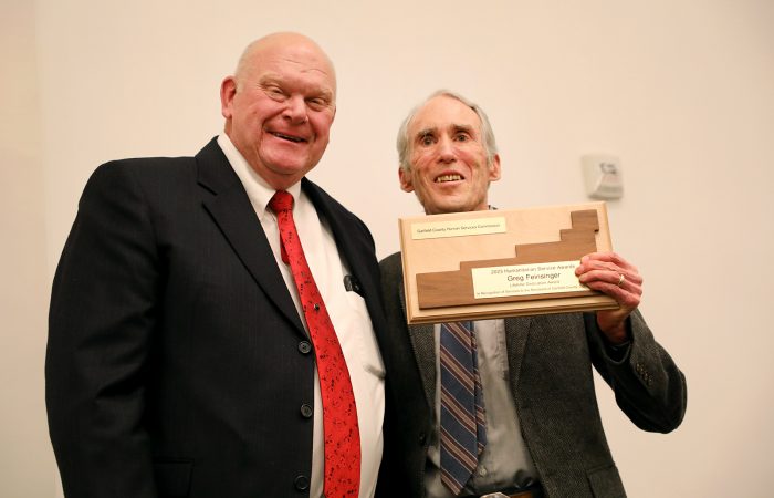 Dr. Greg Feinsinger receives the 2023 Lifetime Dedication Award at the Garfield County Humanitarian Awards celebration in Glenwood Springs on April 3, 2023.