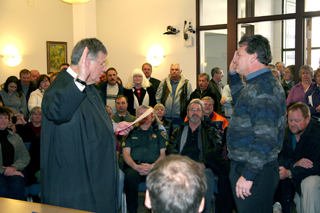 Scott Aibner, county surveyor, takes the oath of office